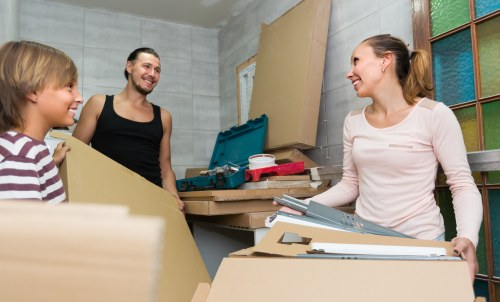 Removal team beginning a move in Dulwich with packed boxes and furniture