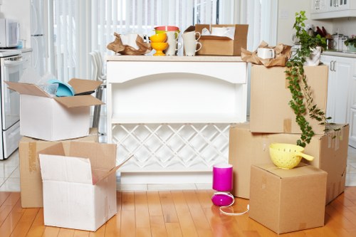 Office relocation planning in Dulwich with packed boxes and moving equipment