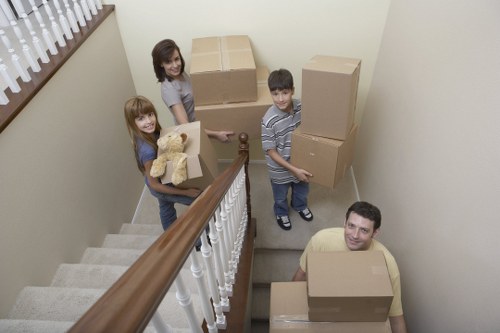 Removalists carrying household items through a residential property in Dulwich